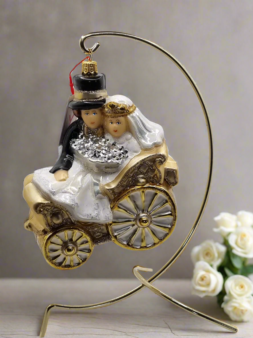 European Glass Christmas ornament of a Bridal Couple In Wedding Carriage (Z)
