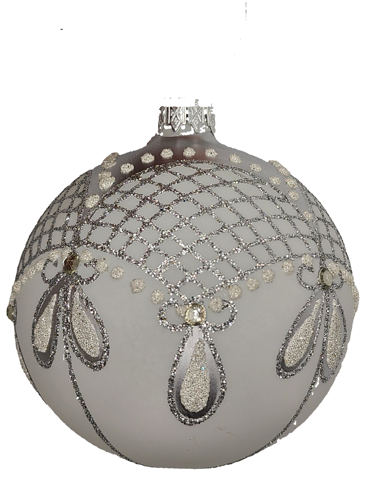 Decorative silver ornament against a light background