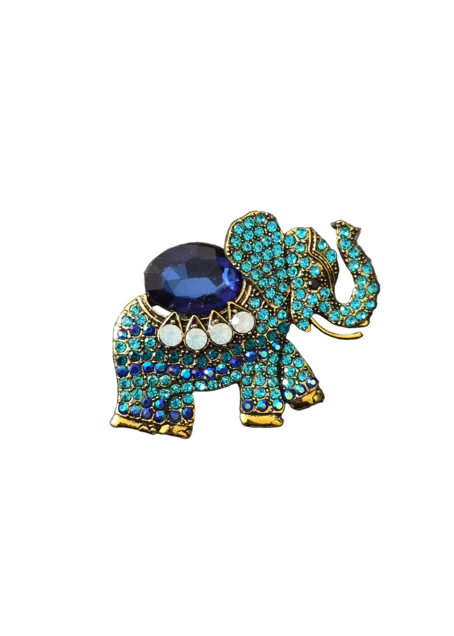 An elephant-shaped brooch or pin embellished with turquoise blue rhinestones, gold-tone metal outlines, a large dark blue oval stone on its back, and three small white stones.
