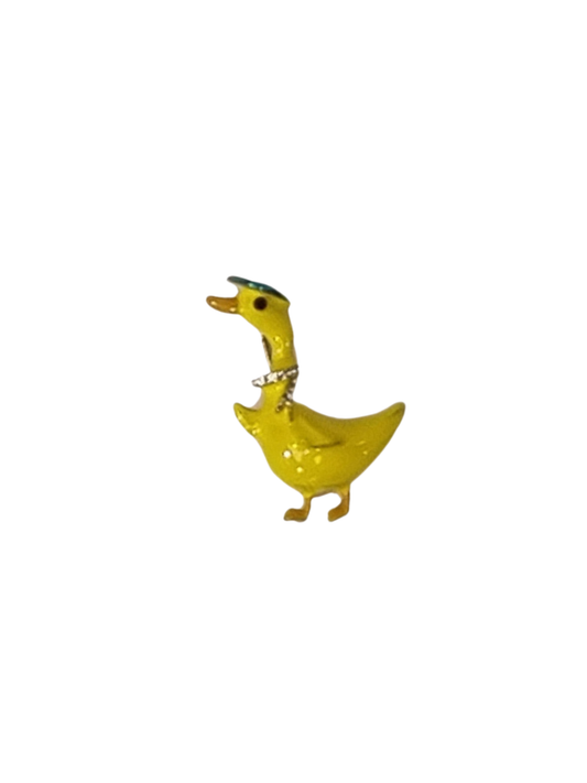 Yellow duck figurine with a hat on a white background