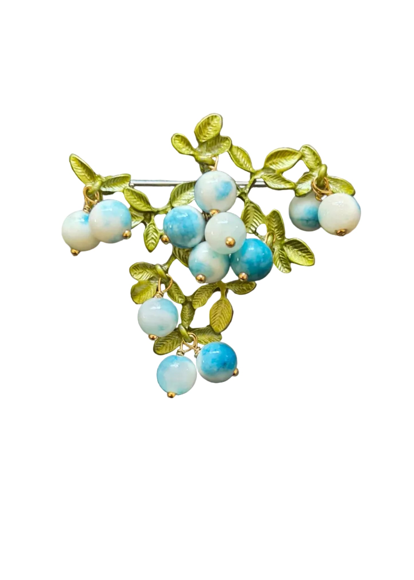 A vintage-style brooch featuring light blue and white marbled beads on a gold-tone branch with green leaves.