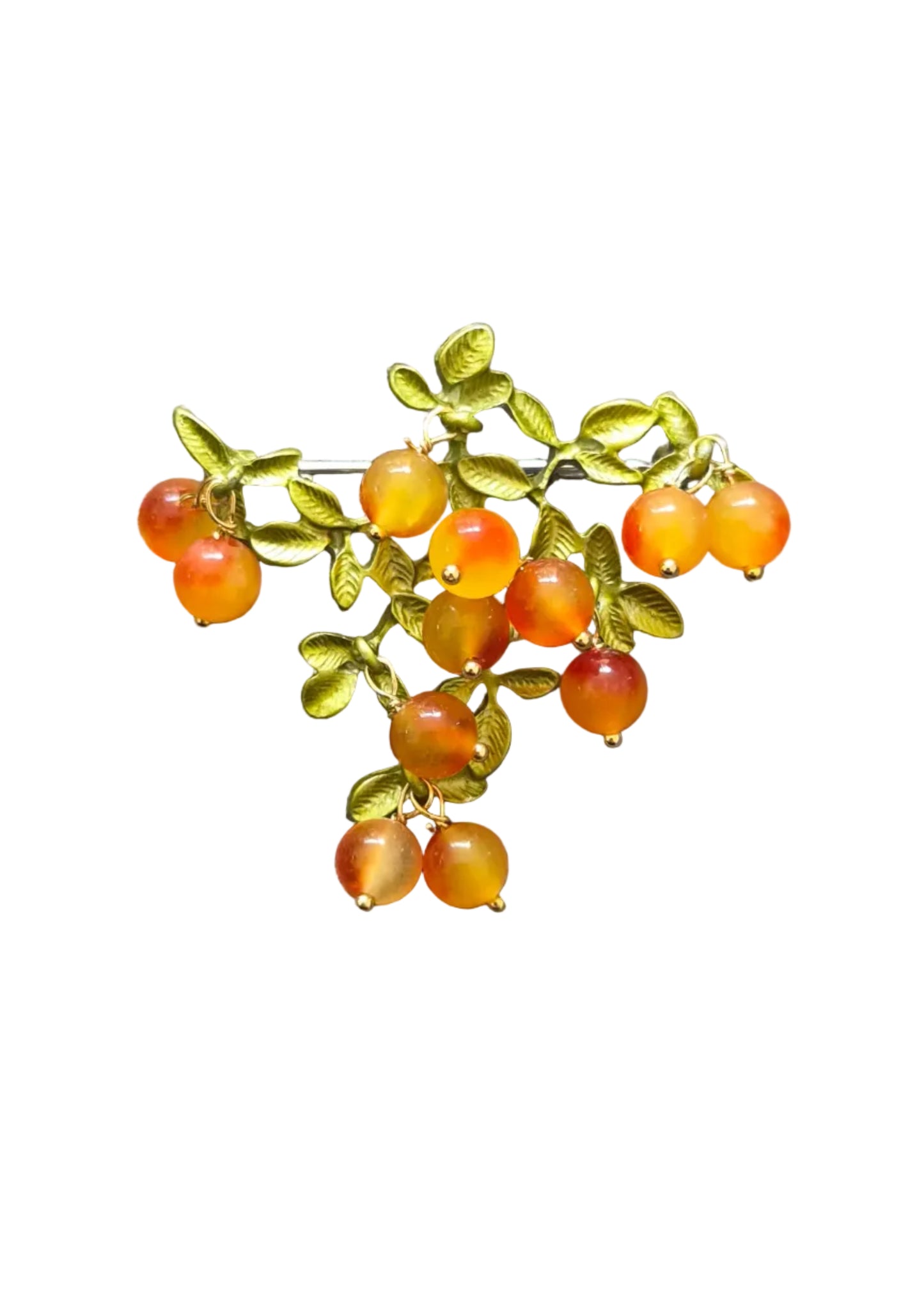 A cluster brooch featuring small orange and yellow marbled beads shaped like berries, attached to green leafy branches with a silver-tone metal base.