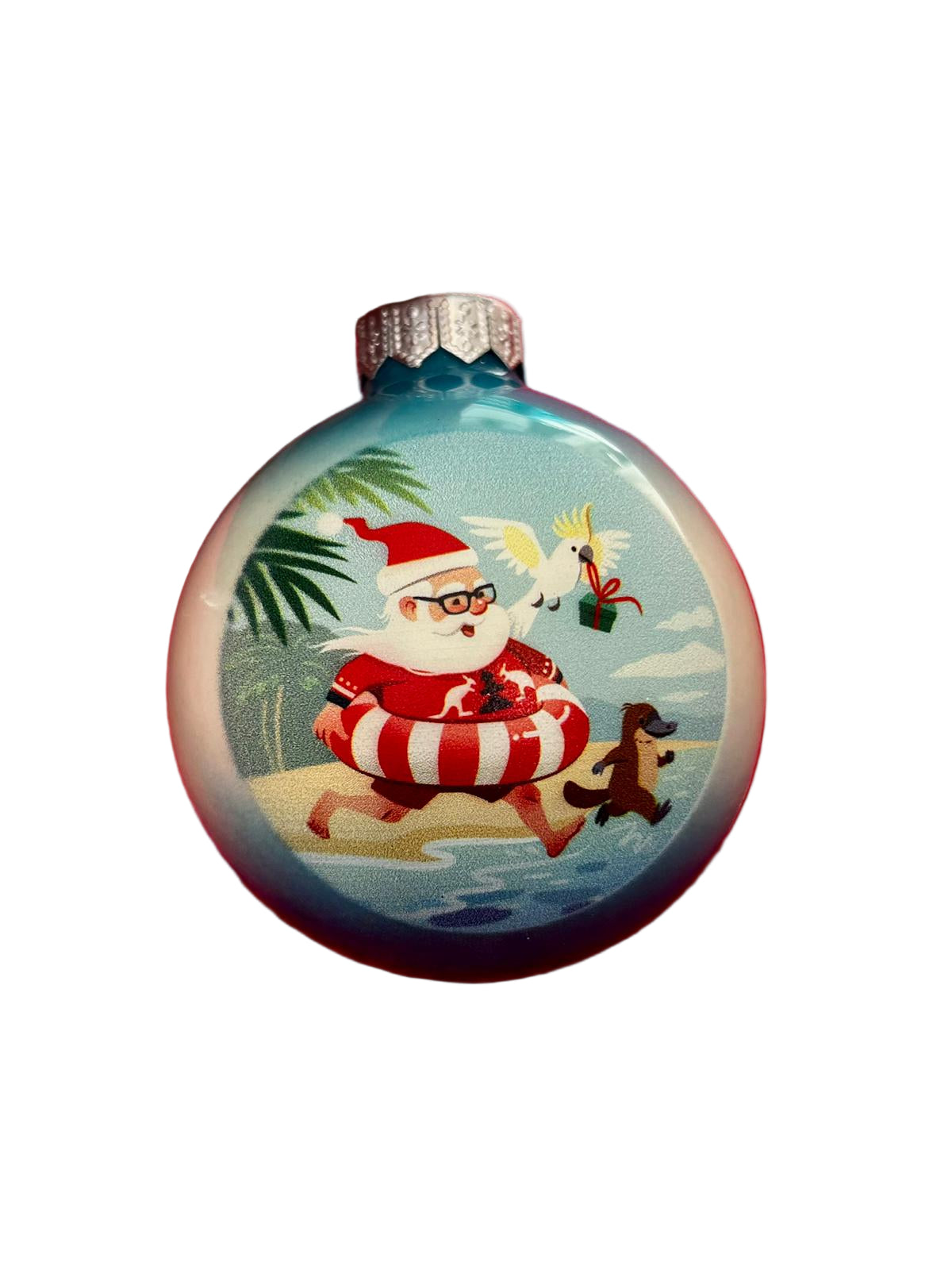 Christmas ornament with Santa Claus in a life buoy on a beach scene