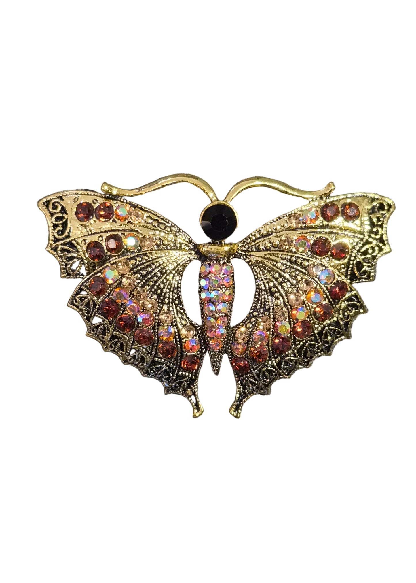 A butterfly-shaped brooch with ornate gold filigree detailing and rows of iridescent and reddish-brown rhinestones