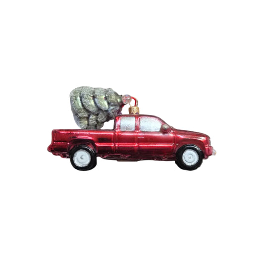 Handmade glass Christmas ornament of a ute with a Christmas tree in the back