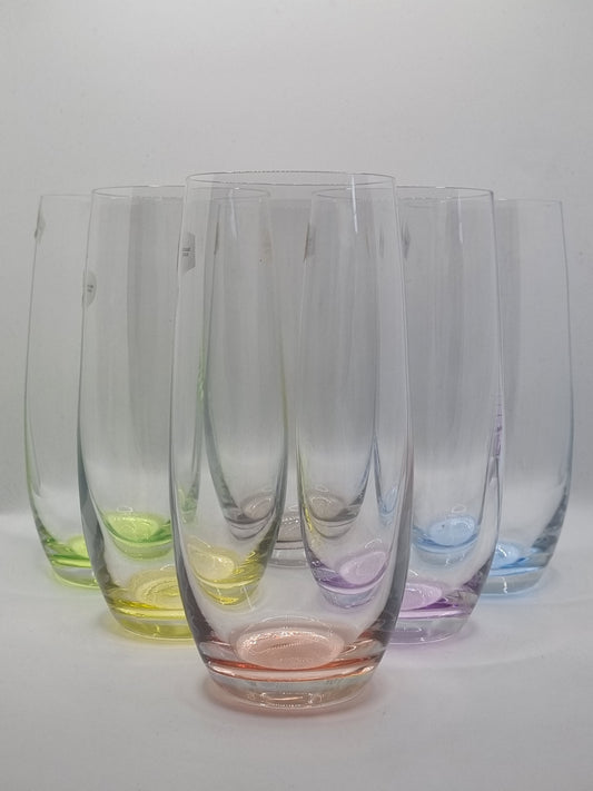 Set of colourful glass tumblers on a white background