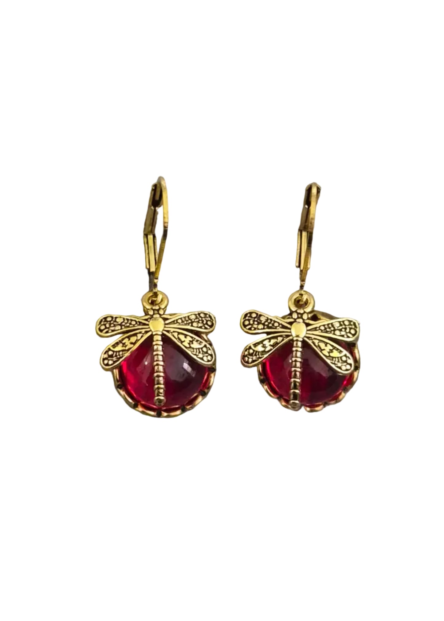 A pair of gold dragonfly drop earrings with red faceted gemstones.